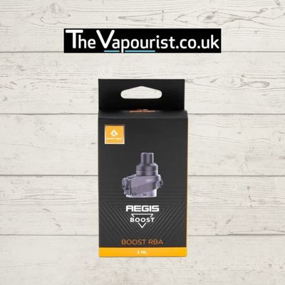 GEEKVAPE Boost RBA rebuildable atomizer in retail packaging, designed for the original GEEKVAPE Boost, displayed on a wooden background.