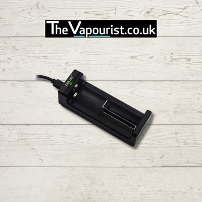 Golisi Needle 1 Charger - single charging slot designed for 18650 batteries, compact USB-powered vaporizer battery charger on wood background.