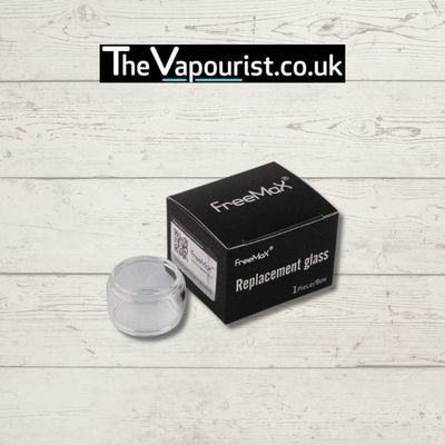 FreeMax Fireluke 4ml Glass Replacement with box, shown on wooden background. Durable Pyrex glass for extended vaping sessions.