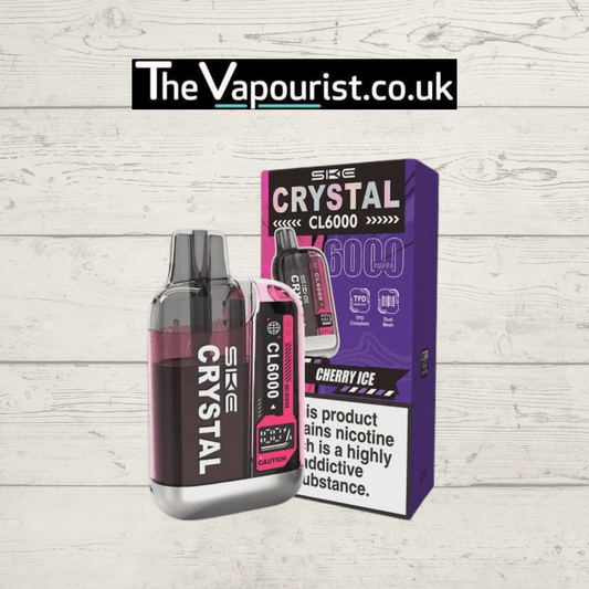 SKE Crystal CL6000 Prefilled Pod Kit Cherry Ice with sleek black and pink design, shown next to branded packaging for long lasting flavour vaping.
