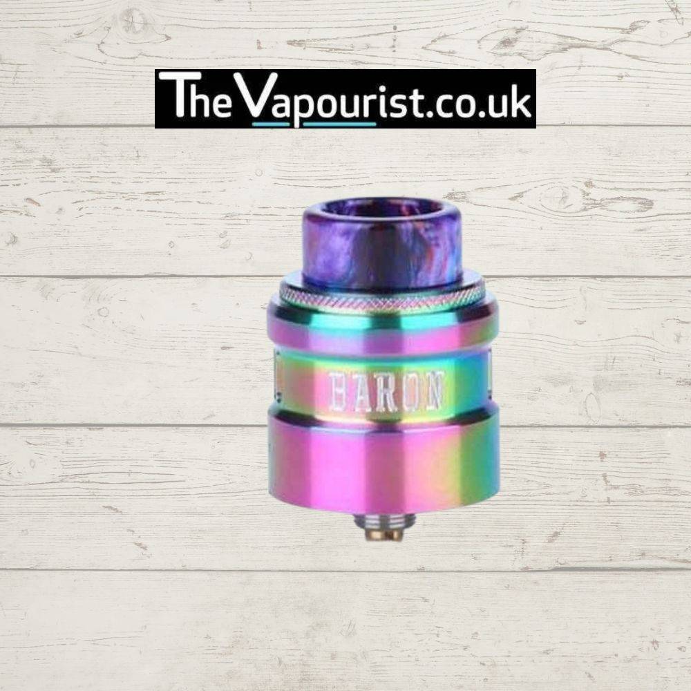 GEEKVAPE Baron RDA in rainbow finish with wide bore resin drip tip, displayed against a rustic wood background for TheVapourist.co.uk product listing.