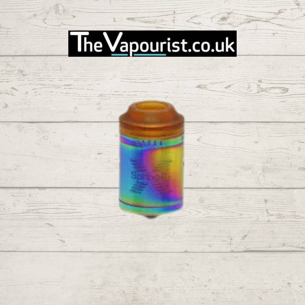 Tigertek Springer X RDA in rainbow finish featuring a spring-loaded clamp deck and wide bore drip tip, perfect for colorful vape setups.