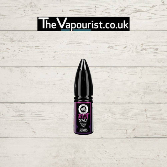 Riot Salt Purple Burst - fruity-meets-icy fusion Salt e-liquid bottle with blackcurrant and menthol flavor, displayed on a white wooden background.