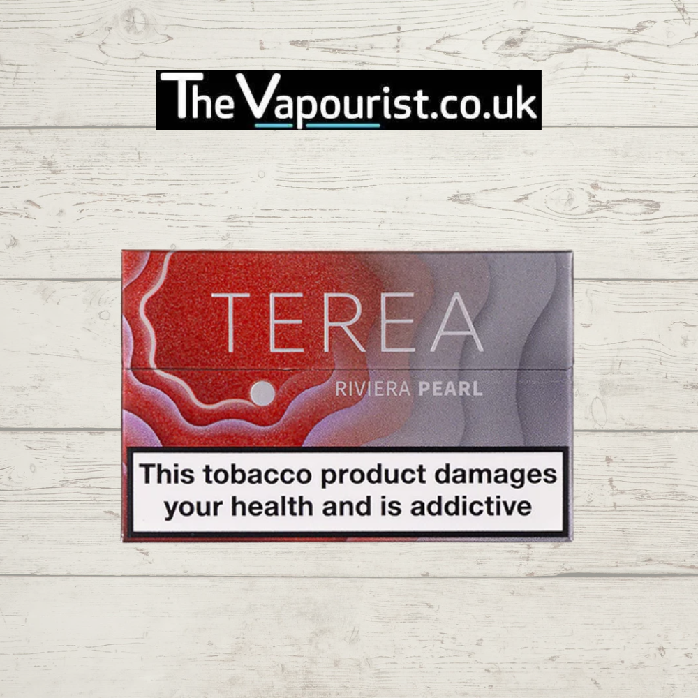 IQOS TEREA Riviera Pearl tobacco vaporizer pack with smooth and mellow flavour, displayed on rustic white wooden background.