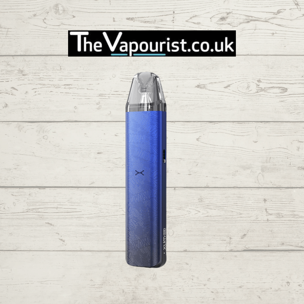 OXVA Xlim SE2 Pod Kit in metallic blue with textured finish, shown upright against a wooden background, highlighting its compact vaporizer design.