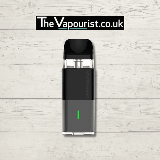 Vaporesso XROS Cube Pod Kit in black with 900mAh battery and leak-resistant design, displayed on wood background for TheVapourist.co.uk.