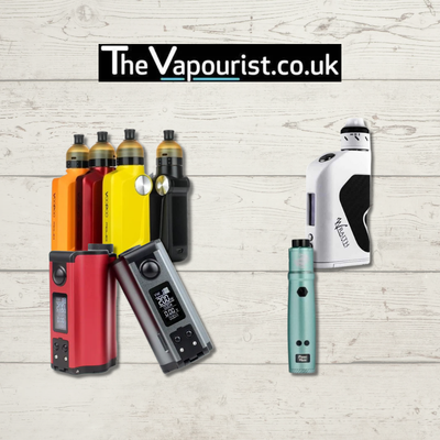 Colorful rebuildable vape kits from The Vapourist on wooden background.