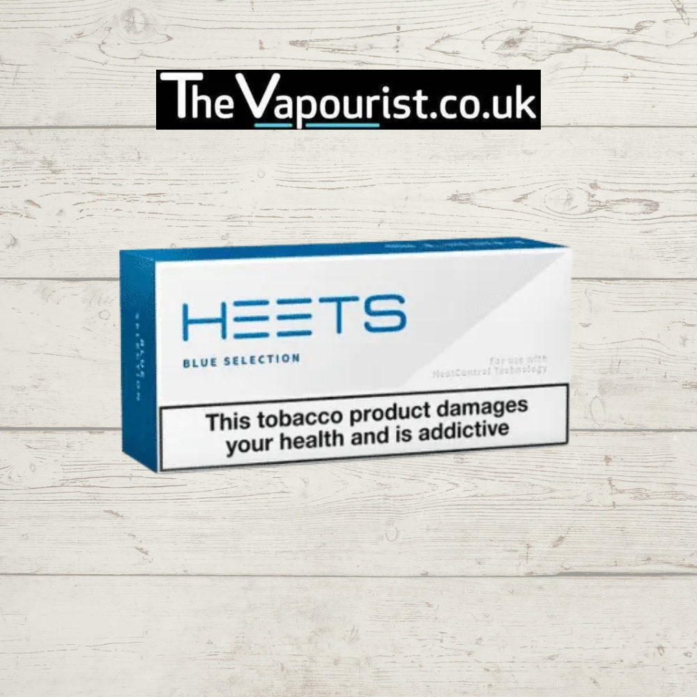 IQOS HEETS Blue Selection menthol tobacco sticks box on wood background.