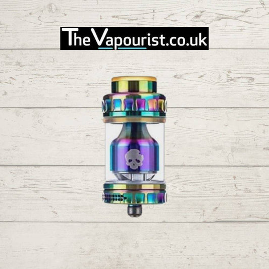 Dovpo Blotto RTA in rainbow finish, a rebuildable tank atomiser for single and dual coil builds, displayed on wood background with TheVapourist.co.uk logo.